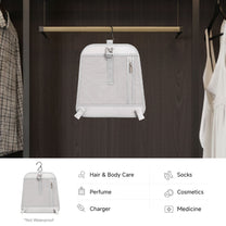 Removable hanging organizer from the LUGGEX 20-inch charcoal aluminum-frame zipperless suitcase, designed for hair and body care, cosmetics, socks, perfume, chargers, and medicine storage.
