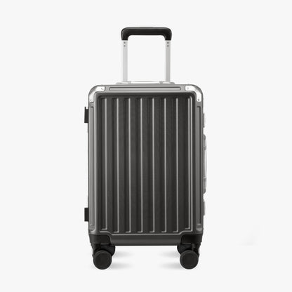Front standing view of the LUGGEX 20-inch aluminum zipperless suitcase with corner protectors and shock-absorbing wheels. 
#color-charcoal