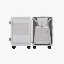 Open view of the LUGGEX 20-inch charcoal aluminum-frame zipperless check-in suitcase showing upgraded interior with greater flexibility, smarter organization, and a waterproof pocket.
