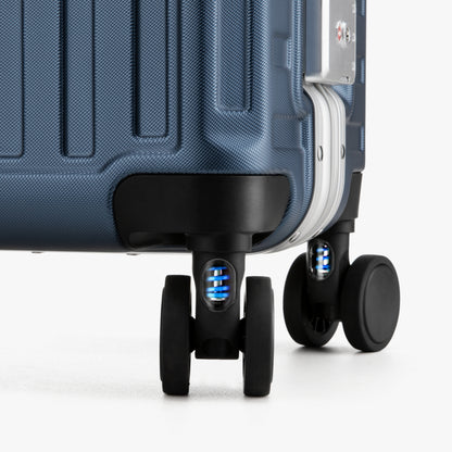 Close-up of LUGGEX 20-inch suitcase silent spinner wheels with shock-absorbing blue springs 