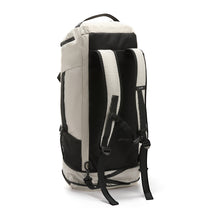 Hidden straps transform the duffel into a comfortable backpack — ideal for gym commutes and weekend travel without switching bags. 

