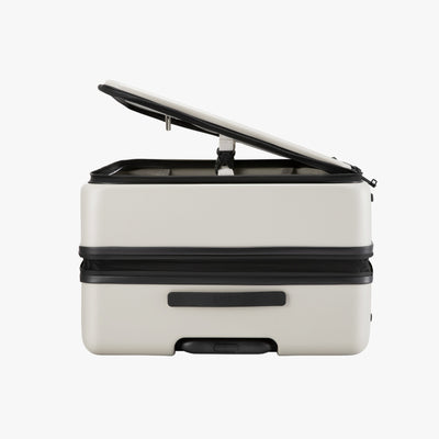 LUGGEX FLO5 28-inch top-open check-in luggage, made from 100% polycarbonate. Space-saving design uses 50% less space—half the footprint and double the convenience—ideal for cars, hotels, and tight spaces. 

