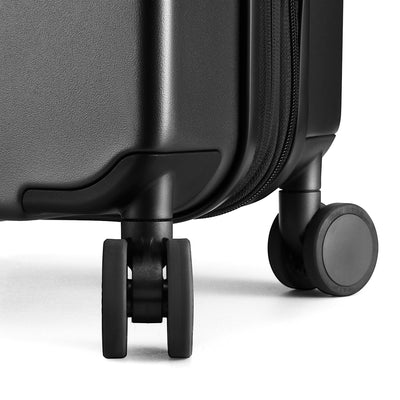 Close-up of LUGGEX luggage 360° silent spinner wheels. Made with durable TPE material for long-lasting performance, providing a smooth, butter-like glide on any surface. 
#color_black #show