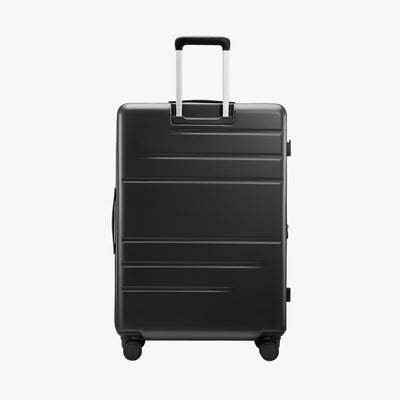 Back view of LUGGEX FLO5 28-inch top-open luggage, showcasing the sturdy aluminum telescopic handle. Built for durability and smooth maneuverability, ideal for long-haul travel. #color_black #show