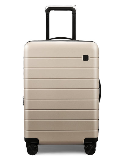 Front view of durable sand dune-colored carry-on luggage constructed from 100% polycarbonate (PC) material, lightweight design for air travel 