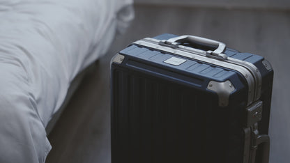 Black Aluminum Zipperless Carry-On Luggage with Reinforced Corner Protectors, Stylish Front-View Design for Modern Travel Essentials
