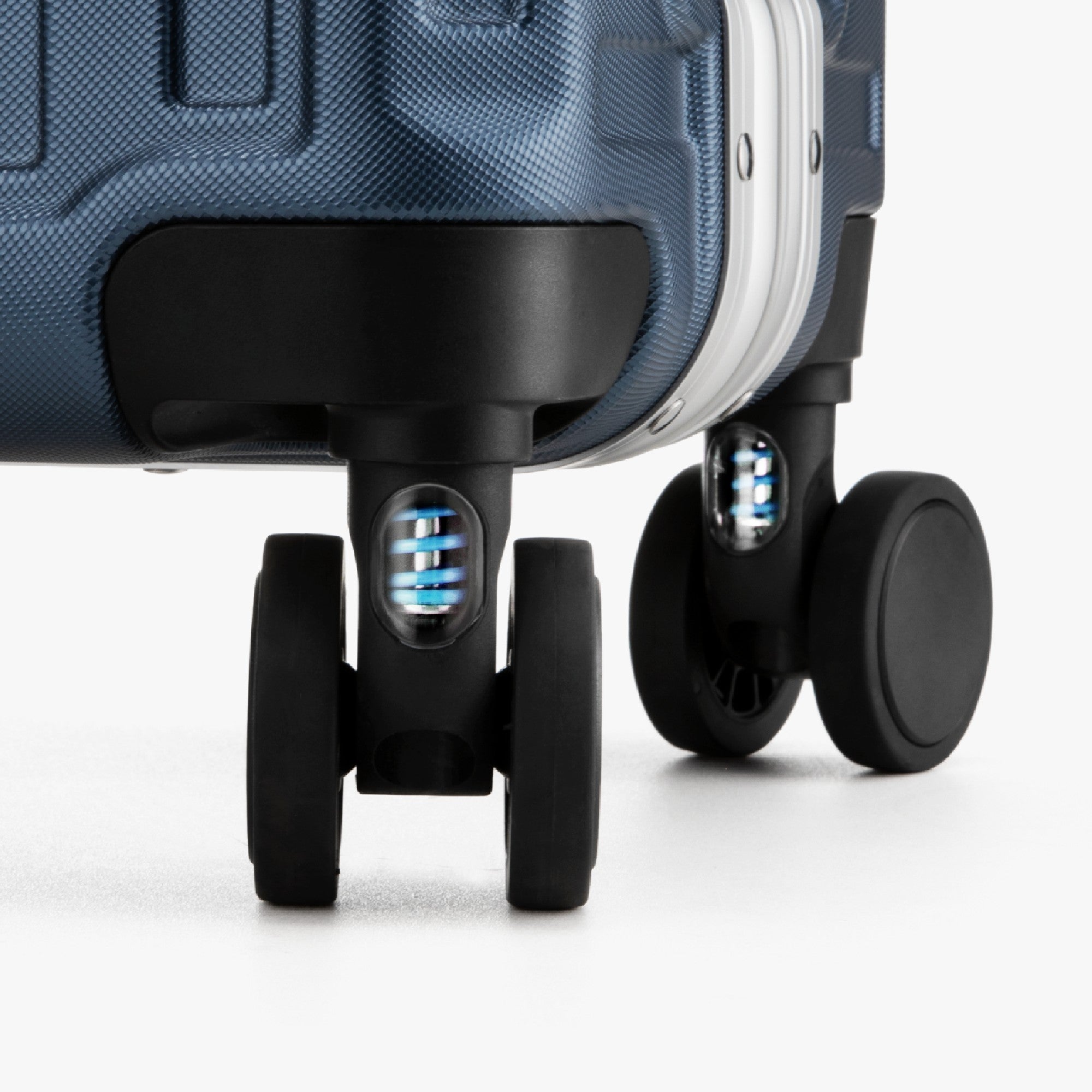 Engineered to cushion every bump, these shock-absorbing wheels glide smoothly across airport floors and city streets—reducing vibration for effortless travel and better luggage protection. 