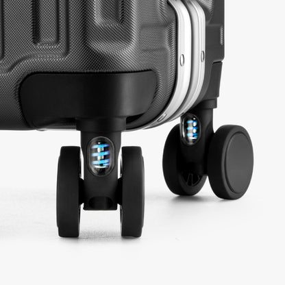 Engineered to cushion every bump, these shock-absorbing wheels glide smoothly across airport floors and city streets—reducing vibration for effortless travel and better luggage protection. 