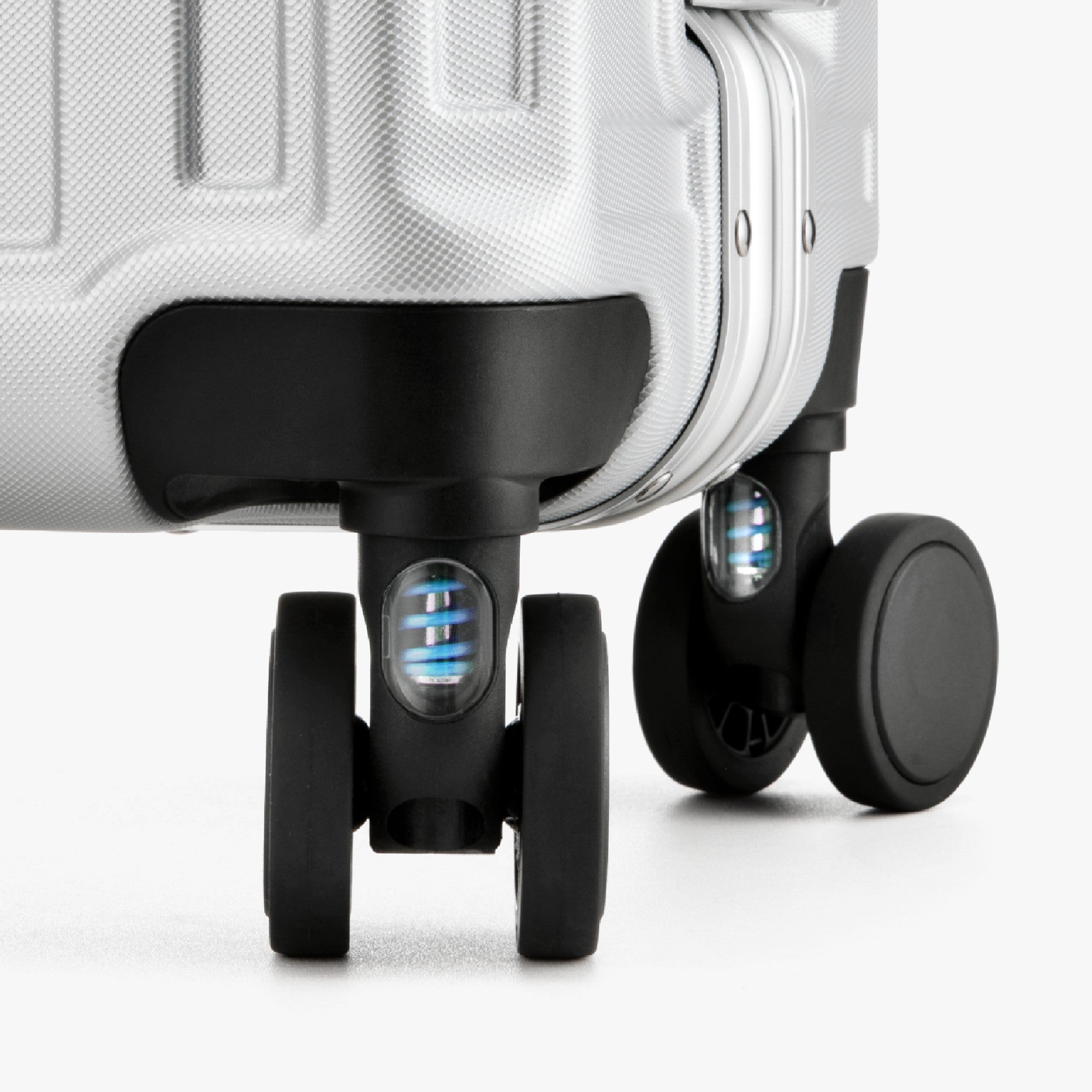 Engineered to cushion every bump, these shock-absorbing wheels glide smoothly across airport floors and city streets—reducing vibration for effortless travel and better luggage protection. 