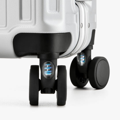 Engineered to cushion every bump, these shock-absorbing wheels glide smoothly across airport floors and city streets—reducing vibration for effortless travel and better luggage protection. 