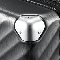 LUGGEX trunk check-in suitcase with reinforced aluminum corner protection designed to help guard against impacts during travel. #show #color_black