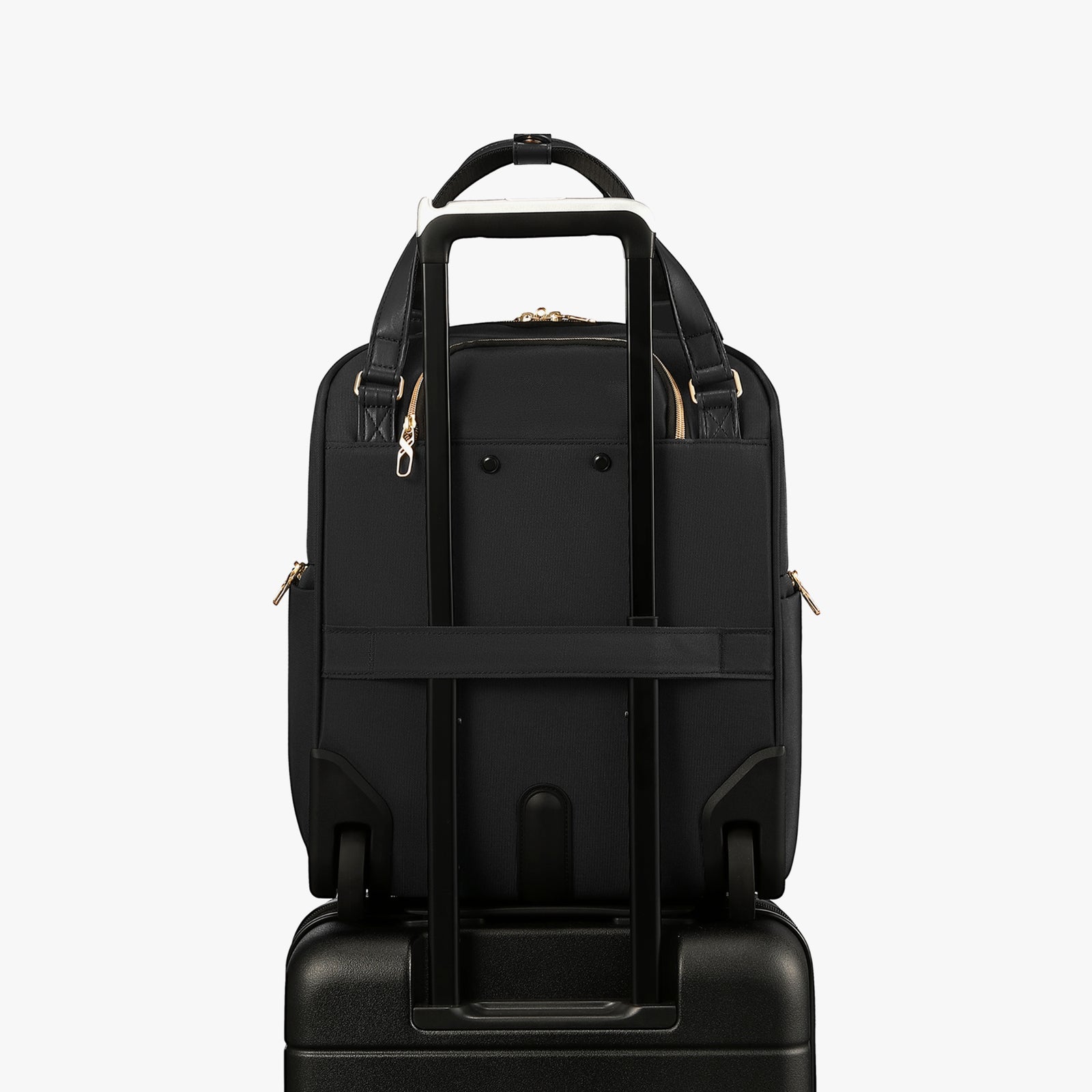Back view of a 16-inch underseat carry-on luggage with a built-in luggage strap, designed to securely attach to a suitcase handle for hands-free travel. 