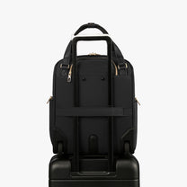 Back view of a 16-inch underseat carry-on luggage with a built-in luggage strap, designed to securely attach to a suitcase handle for hands-free travel. 