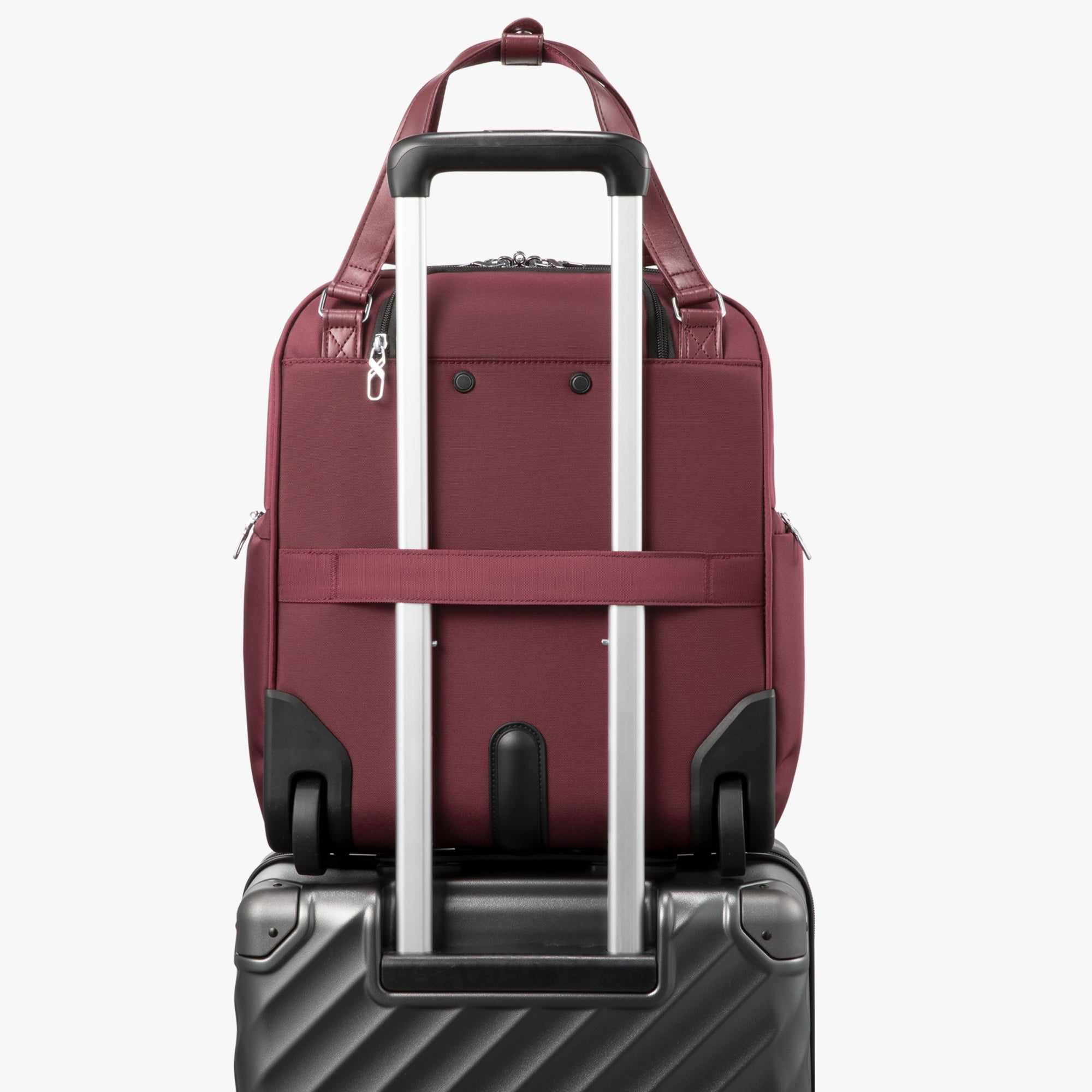 Back view of a 16-inch underseat carry-on luggage with a built-in luggage strap, designed to securely attach to a suitcase handle for hands-free travel. #show #color_cherry-red
